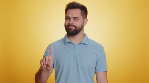 Bearded Man Gesturing No Against Yellow Background