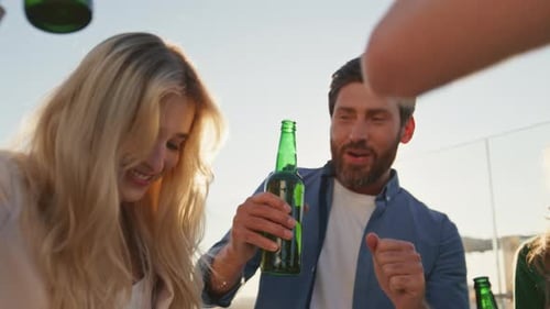 Excited Friends Dancing Party on Summer Rooftop Close Up Diverse Group Laughing