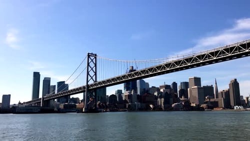 Aerial View Of Bay Bridge With San Francisco Skyline In Background