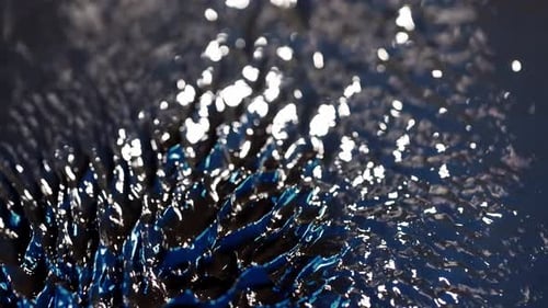 Abstract macro Shot of Magnetic Liquid Ferrofluid moving Motion with blue highlight