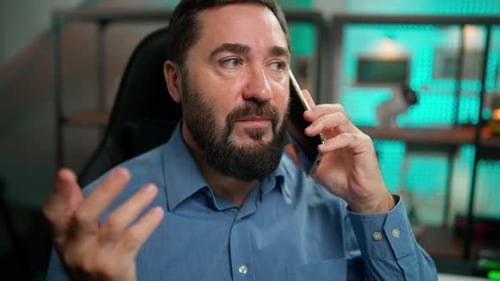 Man Talking on Cell Phone in Office Environment