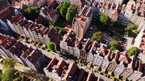 Aerial top view of Gdansk old town rooftops during slow drone pullback