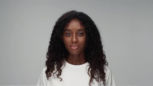 Smiling Young Woman with Curly Black Hair