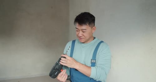 Handyman Worker Showing Up His Tools at Workplace