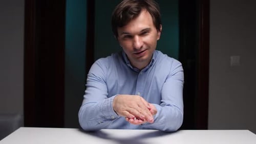 Man Holding a Toy Airplane Indoors
