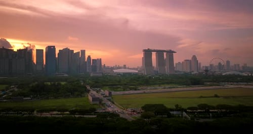 Panoramic aerial view of Singapore skyline and iconic landmarks at sunset
