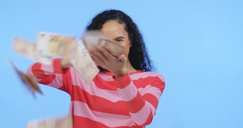 Money rain, black woman and investment growth cash in a isolated studio with blue background