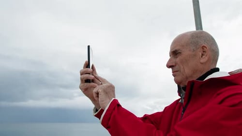 Man Taking Pictures Of The Sea