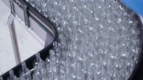 Lot of Bottles Are Carried by Auto Conveyer. Automatic Mill Complex For