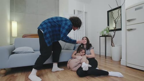 Upset Man Scolding Woman and Child in Living Room