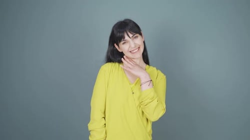 Charming Woman Smiling and Looking Directly at Camera