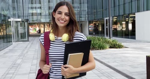 Smiling Student Standing Outside Modern Campus Building