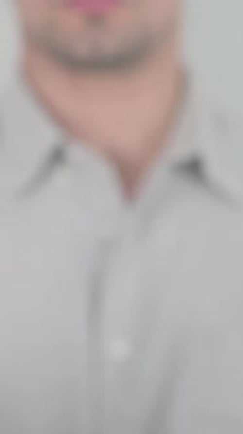 Man Writing The Best With Marker on Glass