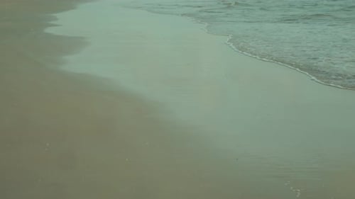 Slow Motion Wave Reaching the Beach