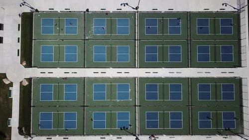 Drone Shot of all 16 Pickle Ball Courts at a local park with many people playing below. (Bluffdale,