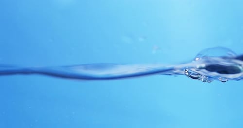 Refreshing Blue Waves. Abstract Water Background with Splashing Bubbles. View of Fresh Water Droplet