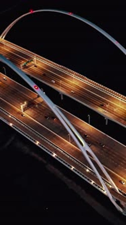 Aerial view of illuminated highways and bridges in Dallas at night