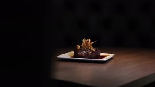 Mouthwatering Gourmet Sirloin Steak with Fried Onions at Fancy Restaurant