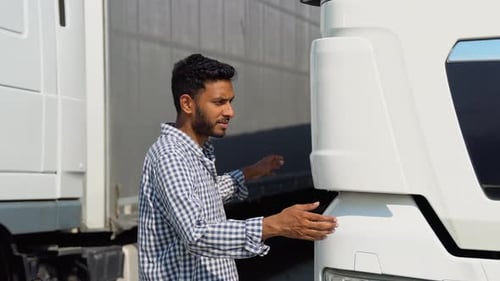 Happy Asian Truck Driver Loving His Job Indian Trucker Hugging His Truck Vehicle for Transportation