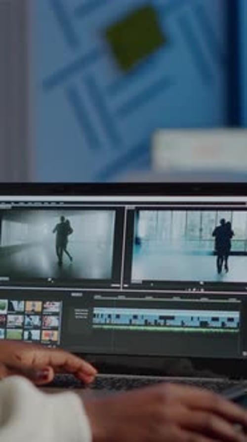 African Videographer Working at Laptop From Office Editing Video Project