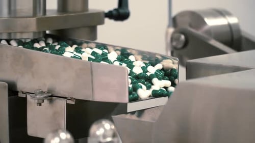 Manufacturing Process of Green and White Pharmaceutical Capsules on Production Line