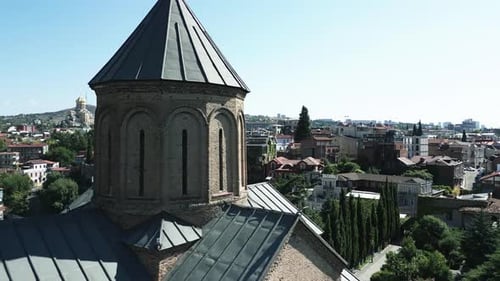 Fly over an old church in the old city of Tbilisi