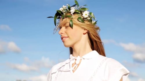 Beautiful Woman with Flower Crown Posing Outdoors