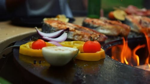 Grilled Salmon and Fresh Vegetables Over Open Flame