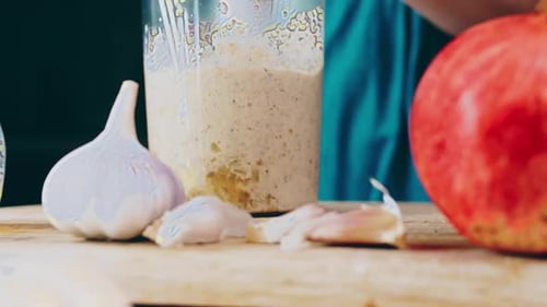 Preparing Healthy Food with Garlic and Pomegranate