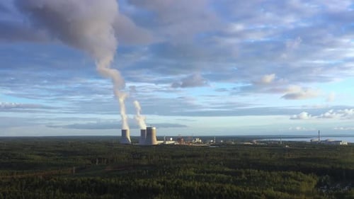 Aerial View on Smoking Cooling Towers at Power Plant