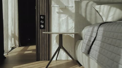 Modern Bedroom with Stylish Side Table and Sunlight