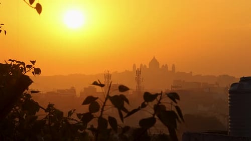 sunrise view of historical palace backlit with orange dramatic sky background at morning