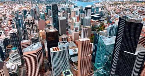 Flying above the stunning cityscape of Seattle downtown with gorgeous skyscrapers in the center