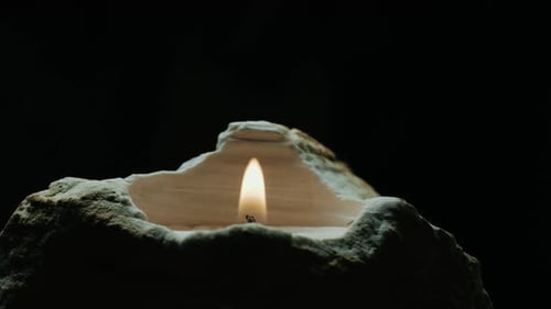 Burning Candle with Rock Holder on Black