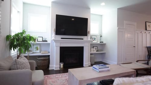 Light Interior of modern living room, with TV and green plant. 4K footage.