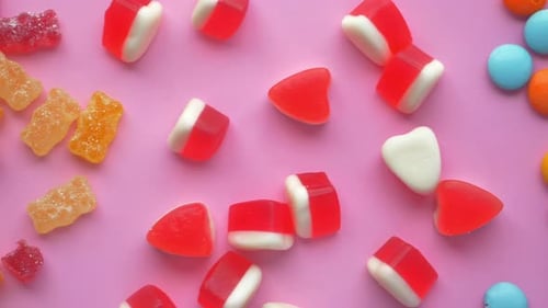 Top View of Colorful Candy Sweet Jelly on Pick Background