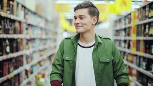 Young Smiling Man Walk with Shopping Cart at the Supermarket Feel Happy Hypermarket Hand Food Shop