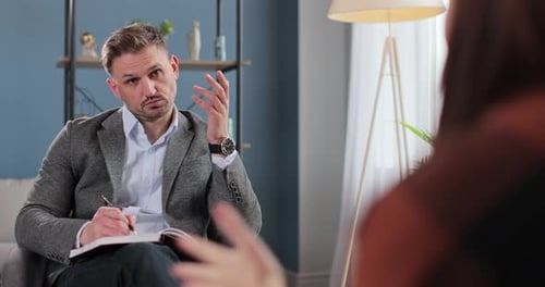 Man Listens Attentively in Therapy Session