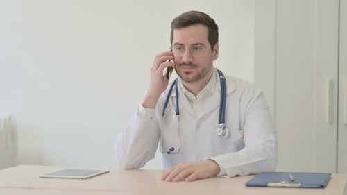 Doctor Talking on Phone in Clinic