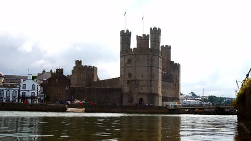 Historic Caernarfon castle Welsh medieval harbour waterfront town landmark