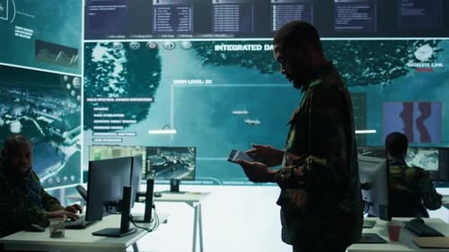 Cybersecurity Specialist Operates in a High Tech Military Control Center