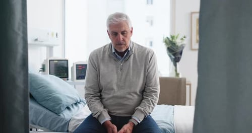 Stress, patient and old man in hospital room, sick and waiting for appointment
