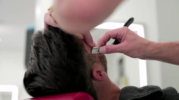 Barber Using Straight razor On A Client, Medical Stock Footage ft ...