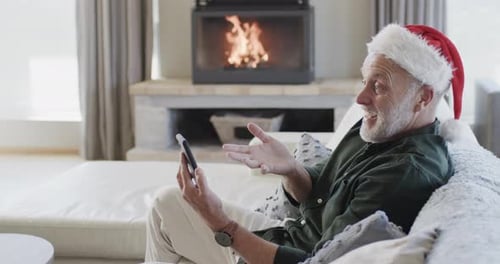 Senior Man Having a Christmas Video Call at Home