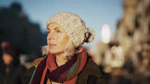 Female City Dweller Portrait in Street in Winter Slow Motion Medium Shot Elderly Townswoman Walking