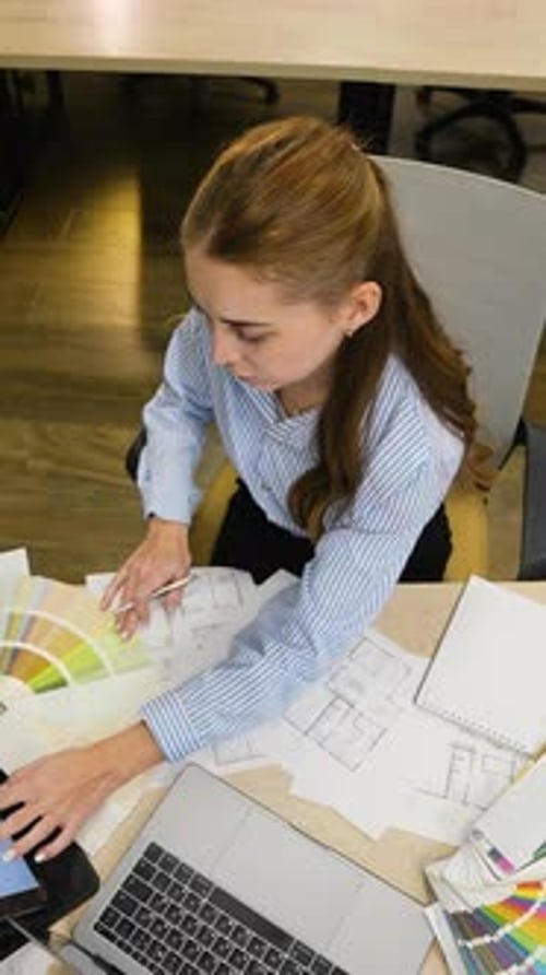 Professional Interior Designer Choosing Colors for Project