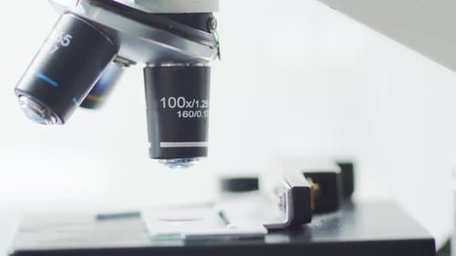 Closeup of Scientific Microscope Laboratory in Hospital Epidemic Disease Healthcare Vaccine Research