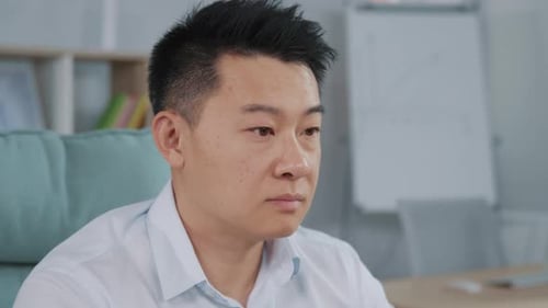 Portrait of Serious Businessman Looking at Computer Screen in Office Asian Male Manager Turning and