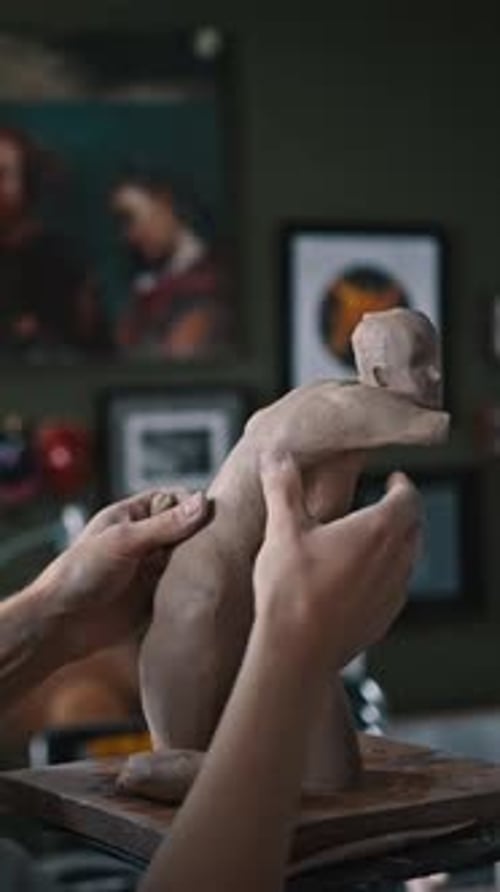 Rear View of Blurred Skilled Sculptor Sculpting a Plaster Statue in His Garage Potting Studio