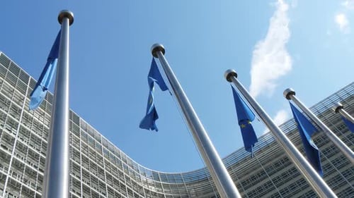 European Union Flags Waving Outside Office Building